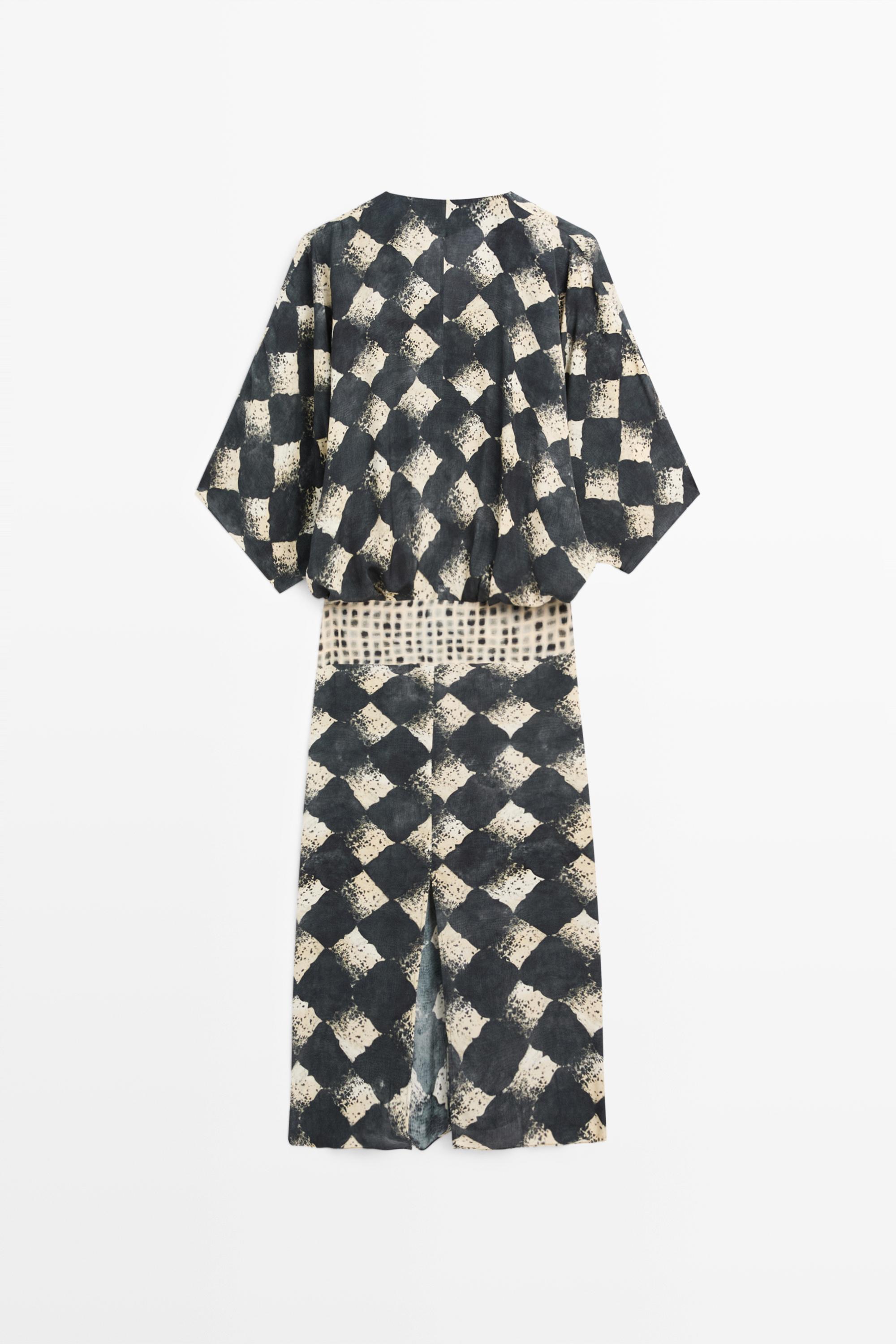 Flowing dress with sash belt detail